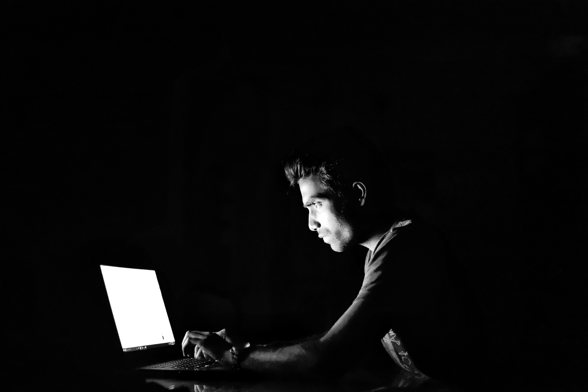 using a laptop in the dark